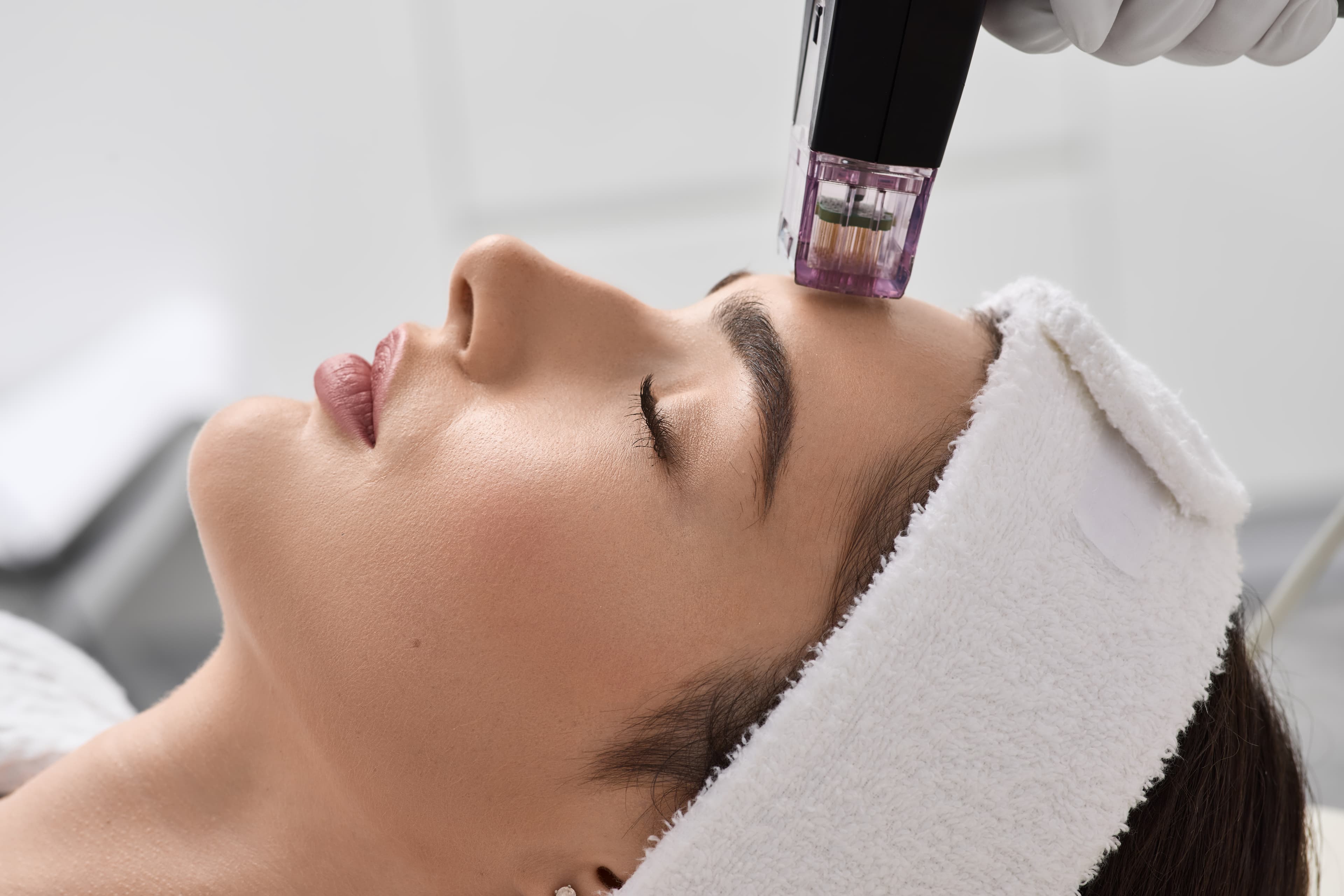 A provider consulting with a client about a treatment plan at a medspa